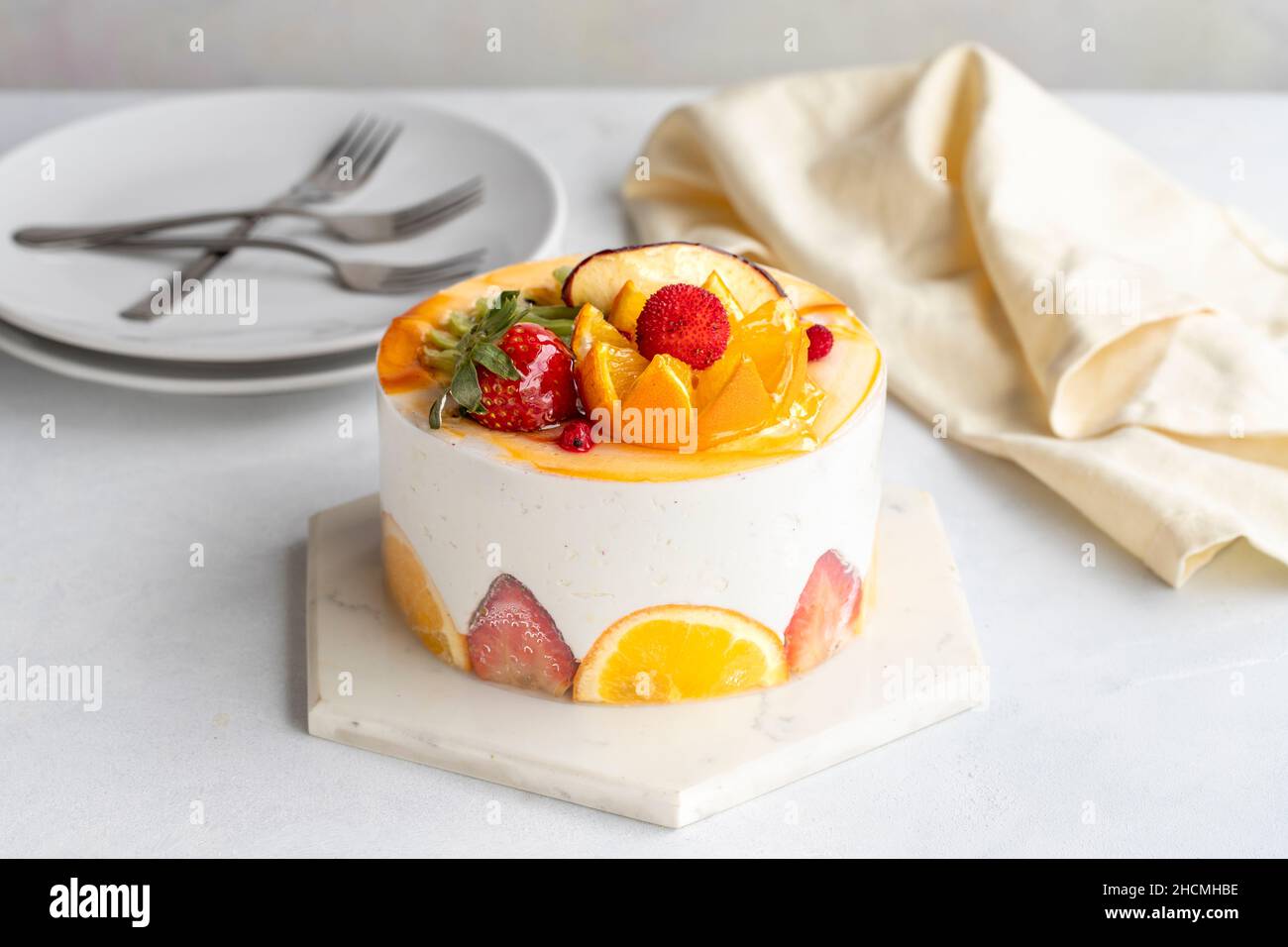 Fruit Parfait Cake on a white background. Fruit cake with white cream. Close-up. Horizontal view Stock Photo