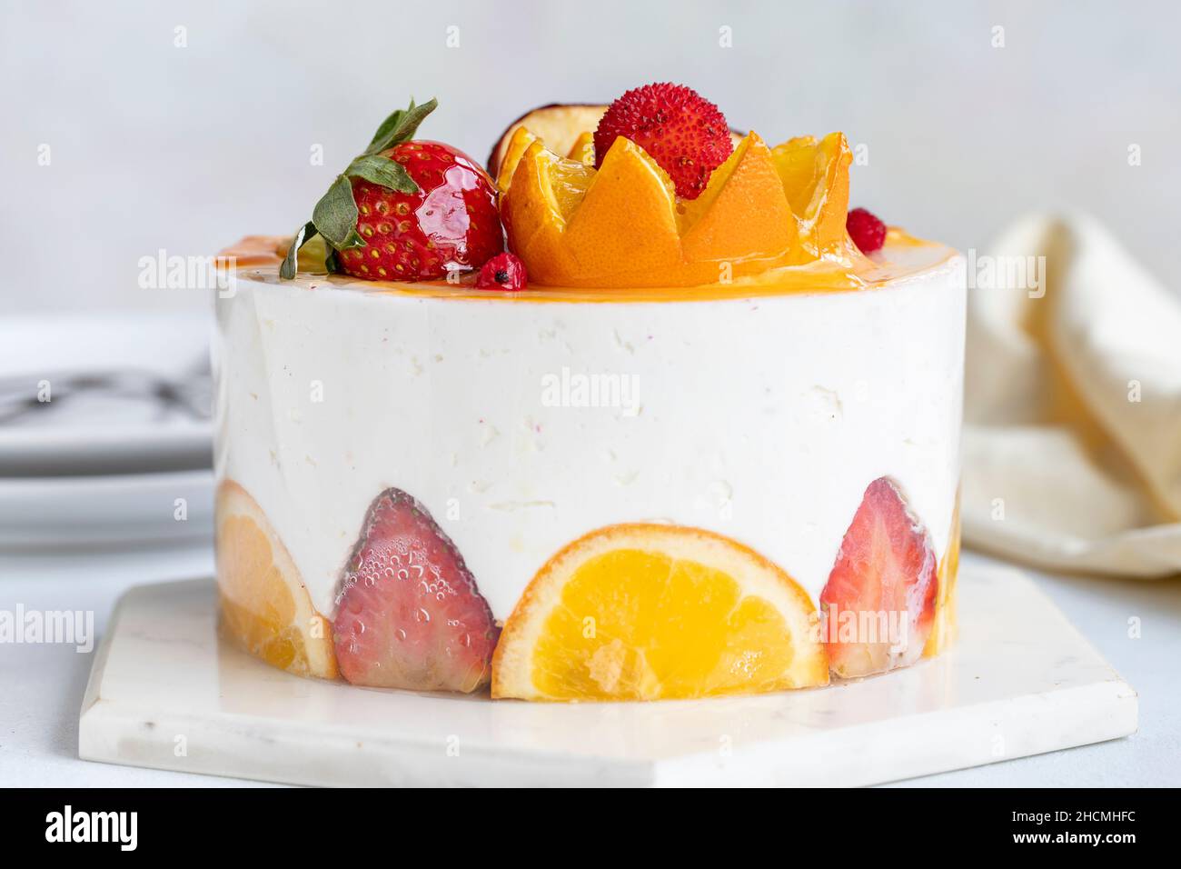 Fruit Parfait Cake on a white background. Fruit cake with white cream. Close-up. Horizontal view Stock Photo