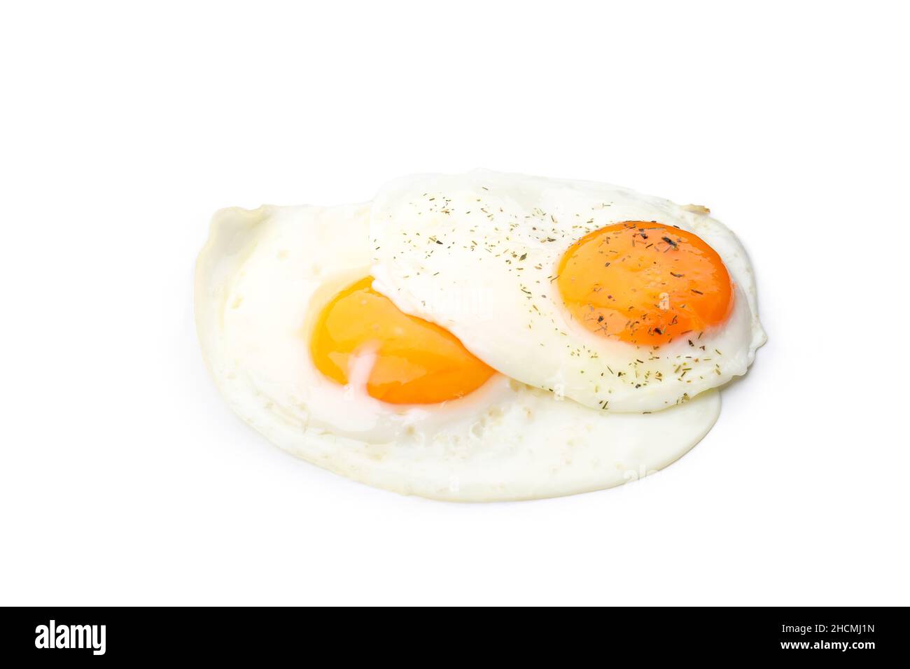 Fried eggs with spices isolated on white background Stock Photo - Alamy