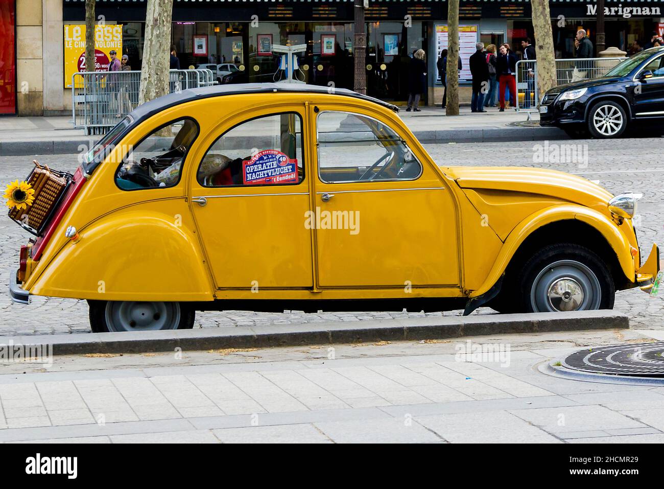 It is an old yellow Citroen Citroen 2 CB, the legend of the French car industry, outdoors May 12, 2013 in Paris, France. Stock Photo