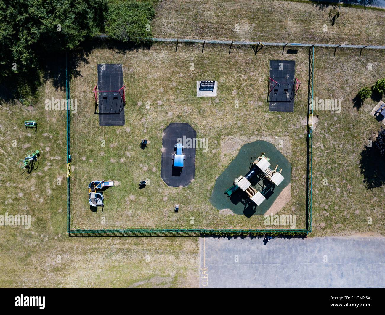 Aerial drone top view of kids play equipment in a public park. Kids playing, play park, play ground, fun, playtime concept Stock Photo