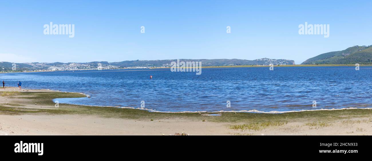 View over the Knysna Lagoon of the popular tourist town of Knysna, Garden Route, Western Cape, South Africa in a panorama banner Stock Photo