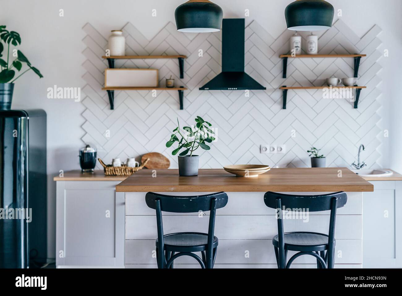 Modern new light interior of kitchen with white furniture and dining ...