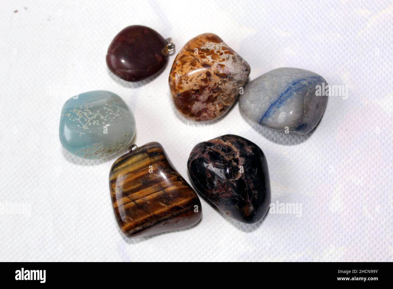Semiprecious stones on a table with white background Stock Photo