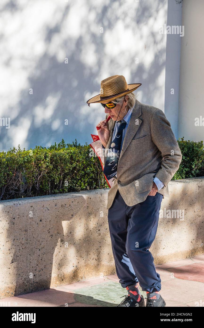 A senior citizen male walking on State Street Stock Photo