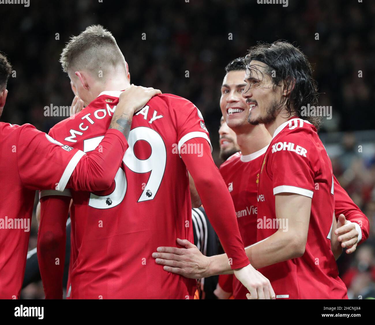 Old Trafford, Manchester, UK. 30th Dec, 2021. Premier League Football Manchester United versus Burnley; Cristiano Ronaldo of Manchester United celebrates with team mate Edinson Cavani of Manchester United after scoring his side's third goal in the 35th minute Credit: Action Plus Sports/Alamy Live News Stock Photo