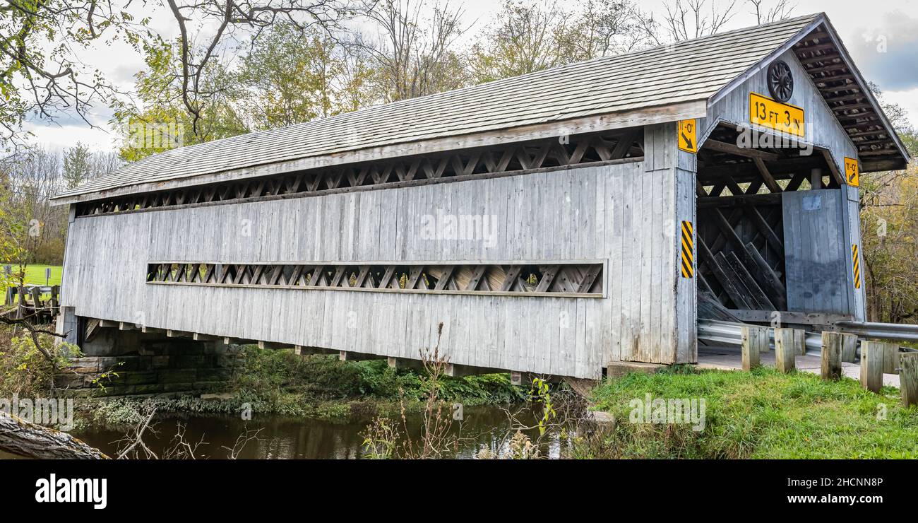 The Doyle Road Covered Bridge crosses Mill Creek during the Autumn leaf color change in