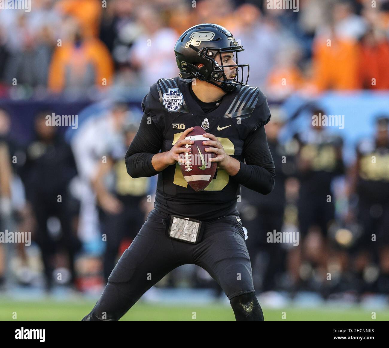 Nashville, TN, USA. 30th Dec, 2021. Purdue QB Aidan O'Connell #16 drops ...