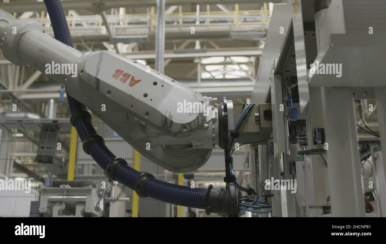 Close up of automatic robotic arm inserting detail into the mechanism