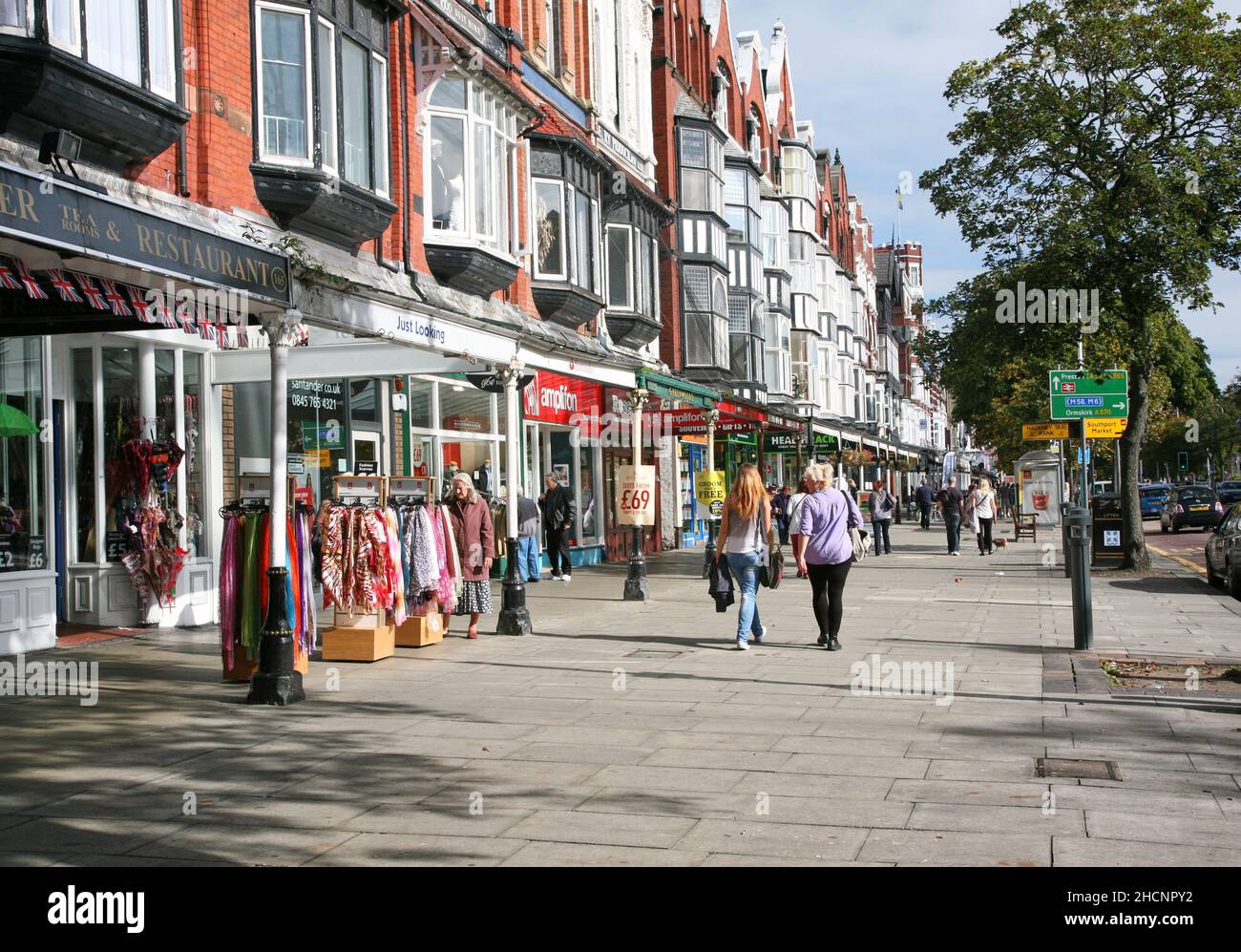 Shoppers enjoying a stroll on lord street Southport Stock Photo