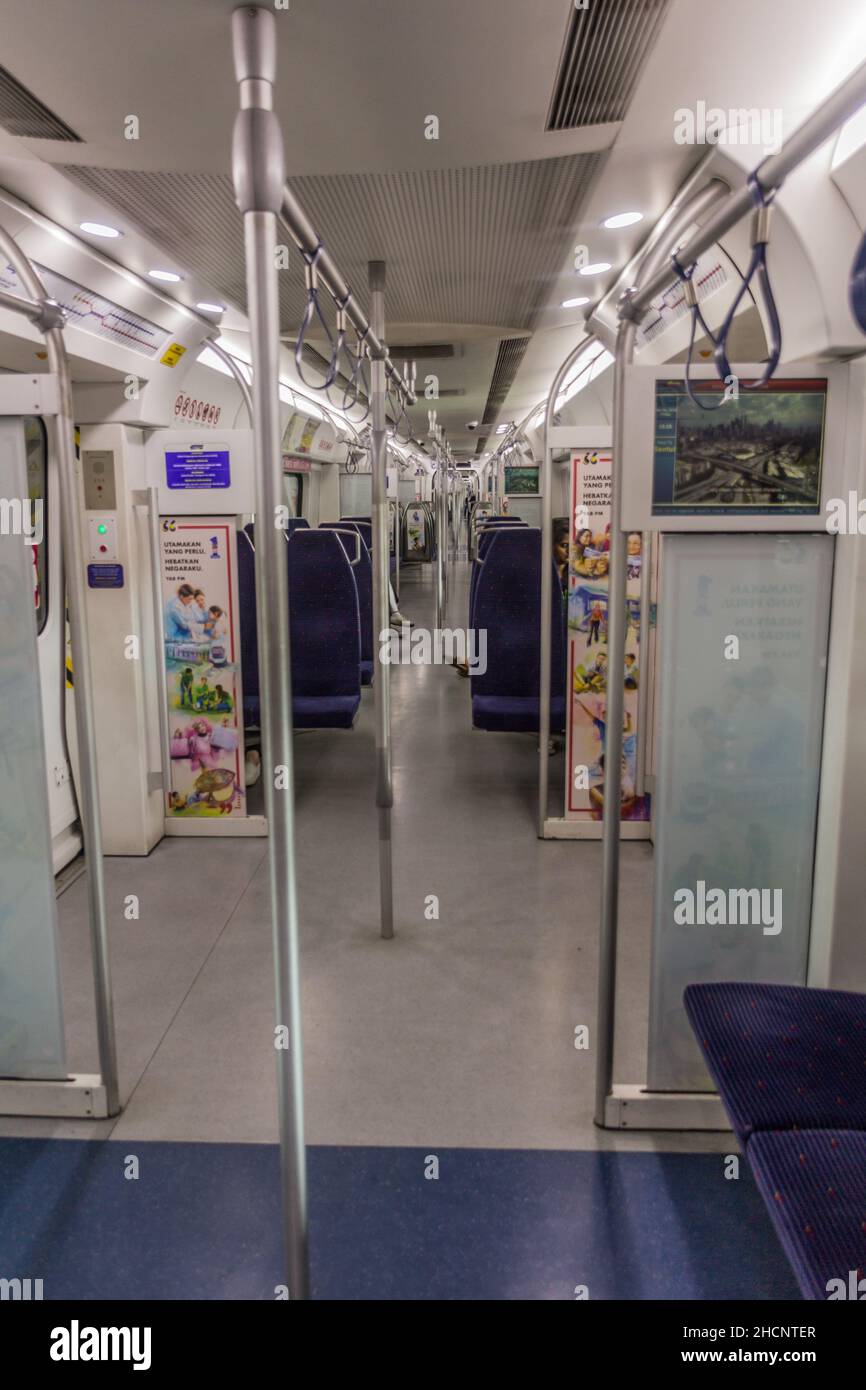 KUALA LUMPUR, MALAYSIA - MARCH 30, 2018: Interior of a commuter train ...