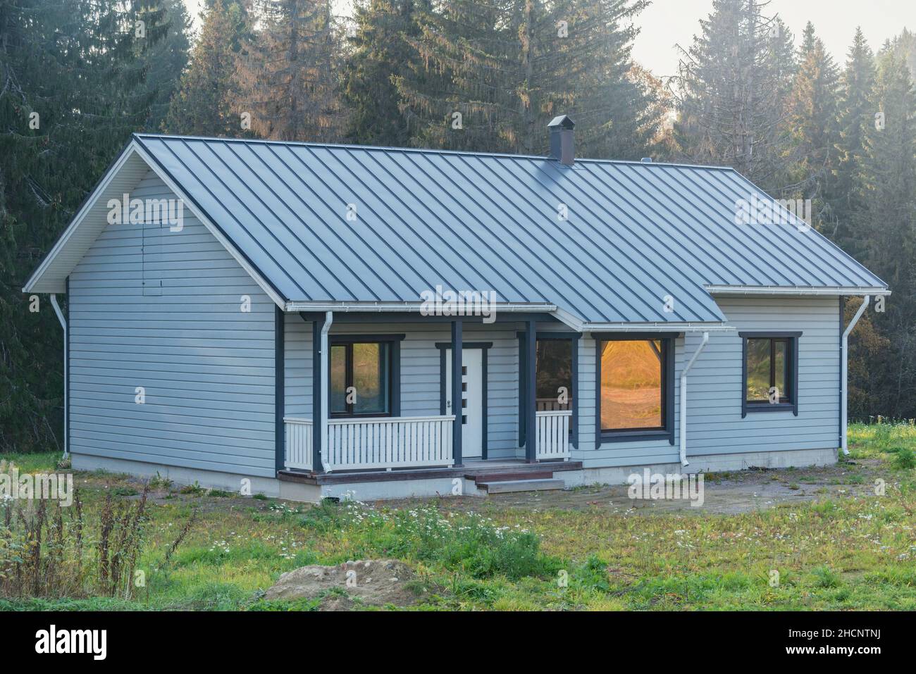 Image showcasing New private house by the edge of the forest Stock Photo - Alamy