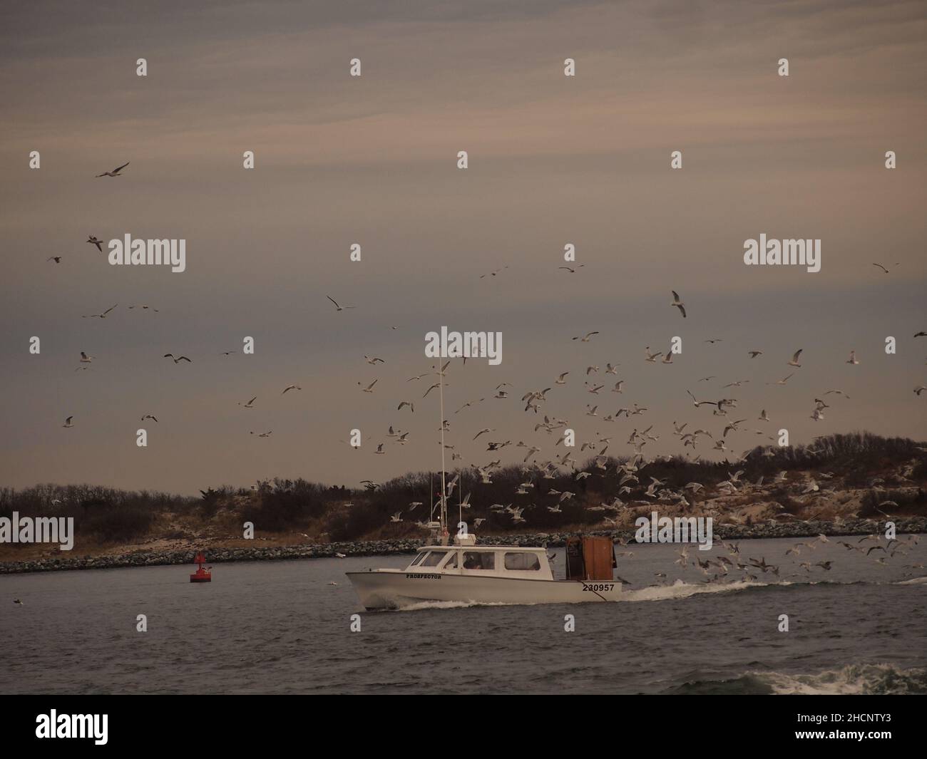 Fishing boat entering Barnegat Bay near the Island Beach State Park