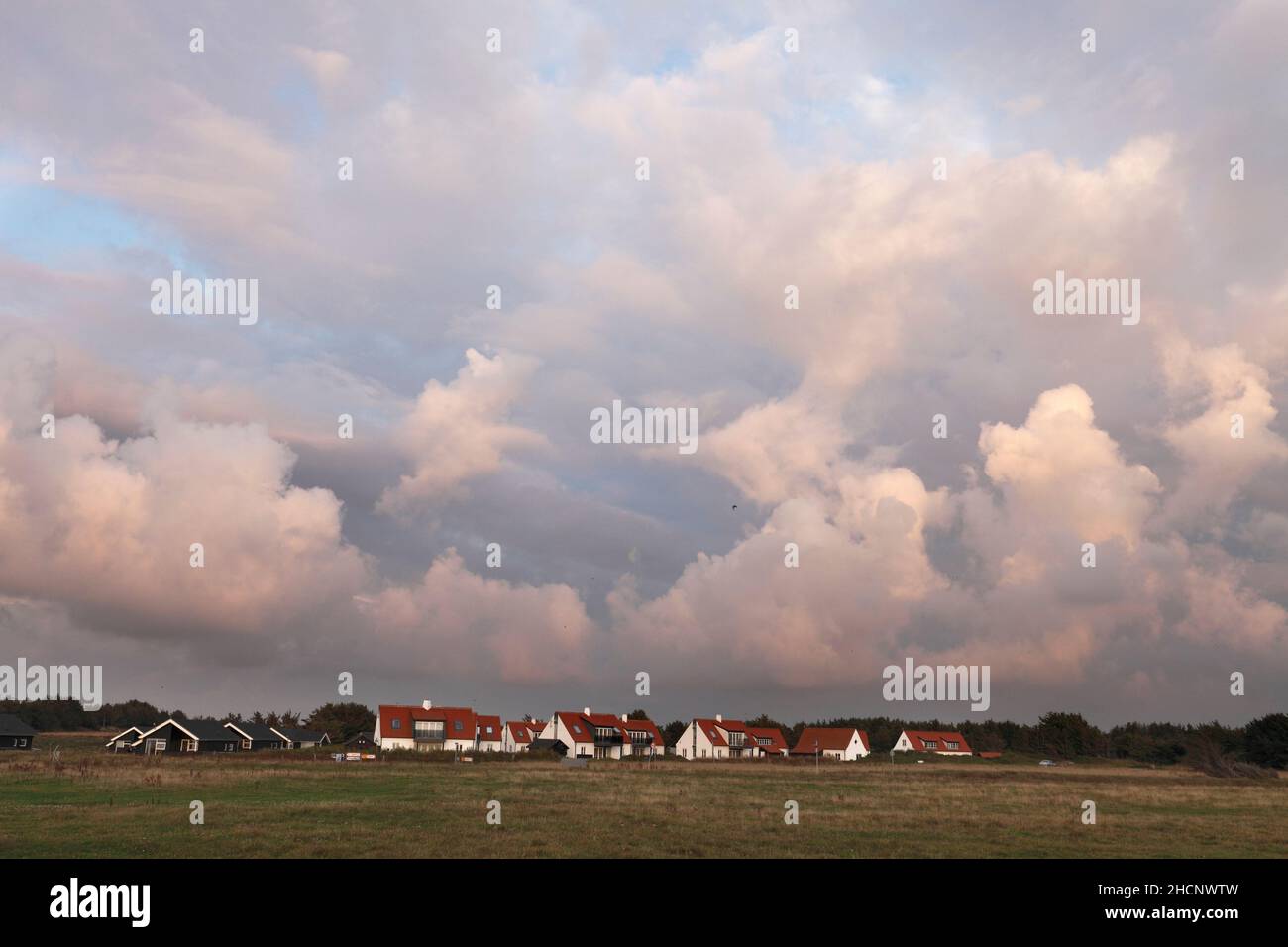 Norre Lyngby, Kommune Hjörring, North Jutland, Denmark, Danish, Dansk Danmark, cottage area, North Sea, Jammerbugten, Jammerbucht, cloudy sky, sunset, Stock Photo