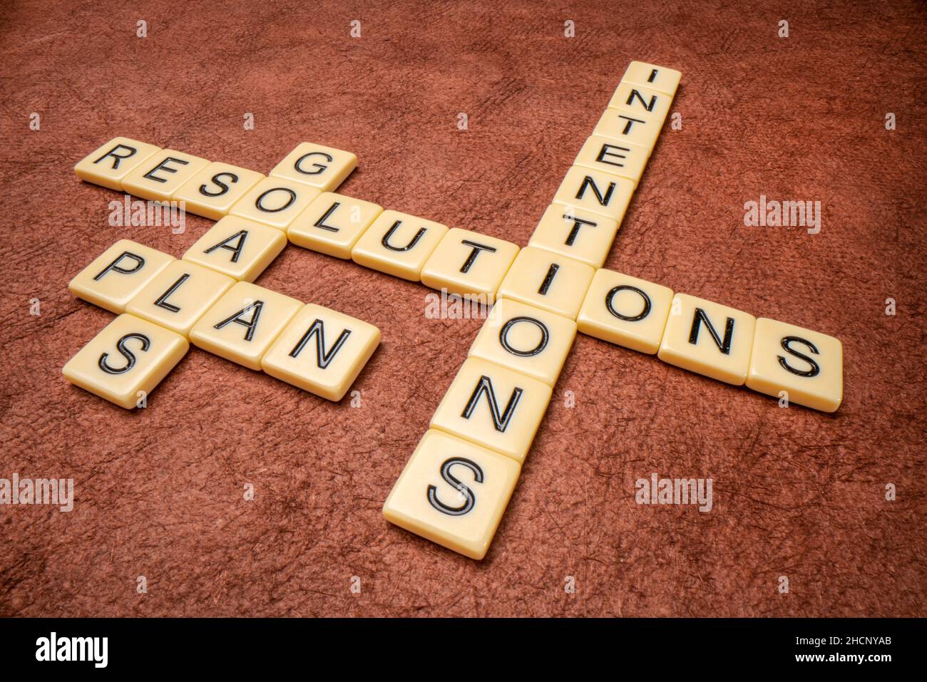 goals, resolutions, intentions, plan crossword against textured