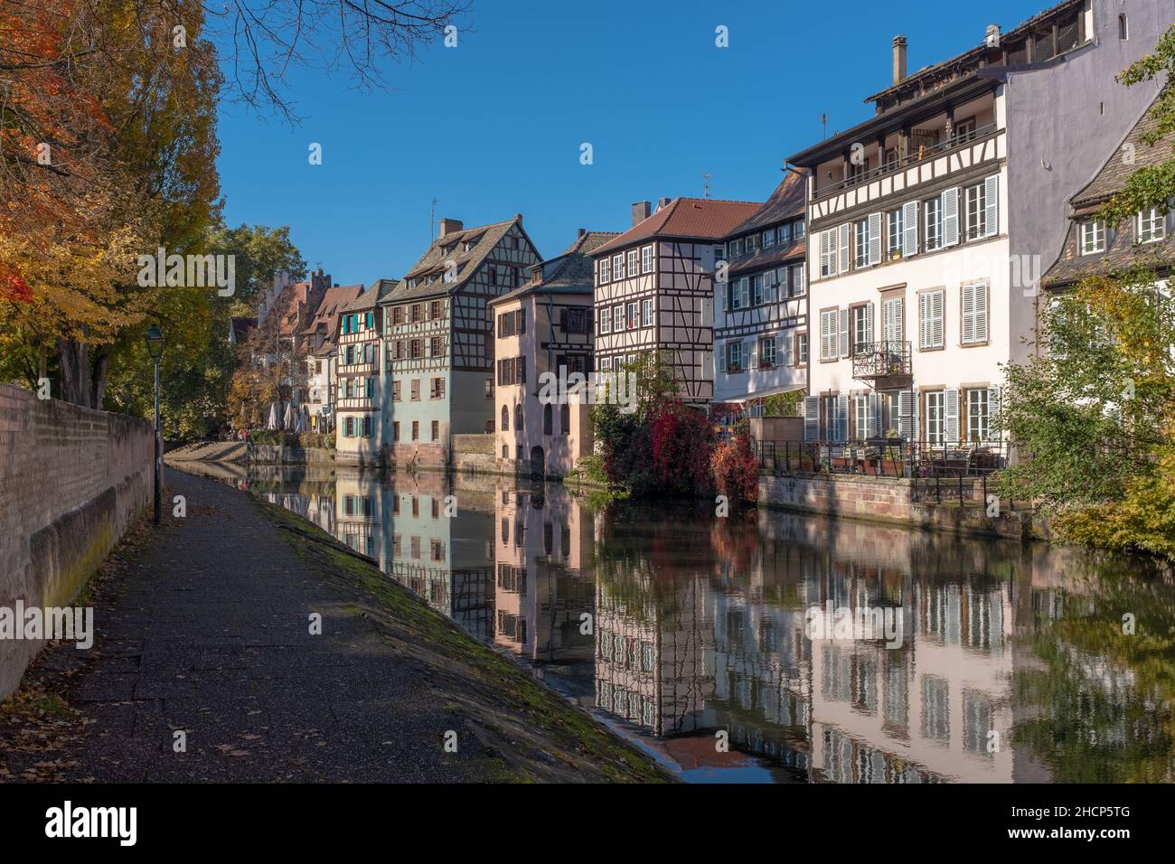 Strasbourg, France - October 24, 2021: Half-timbered houses of the Petite France district, taken on a sunny autumn afternoon with some unrecognizable Stock Photo