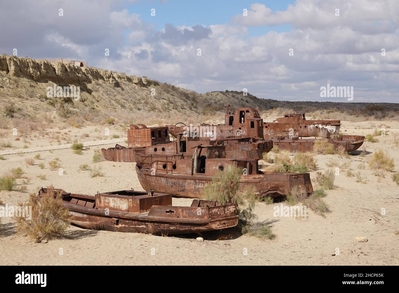 Mujnak, Uzbekistan. 21st Oct, 2021. Rusty ships lie in the sand of the former port city, from which the water retreated decades ago. The salt and sand desert of Aralkum continues to grow. The region is considered the biggest ecological disaster on earth. (to the KORR report 'Eco-disaster Aral Sea: The fight for its remains continues') Credit: Ulf Mauder/dpa/Alamy Live News Stock Photo