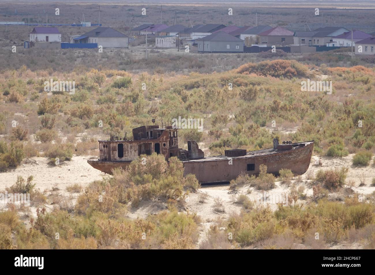 Mujnak, Uzbekistan. 21st Oct, 2021. Rusty ships lie in the sand of the former port city, from which the water retreated decades ago. The salt and sand desert of Aralkum continues to grow. The region is considered the biggest ecological disaster on earth. (to the KORR report "Eco-disaster Aral Sea: The fight for its remains continues") Credit: Ulf Mauder/dpa/Alamy Live News Stock Photo