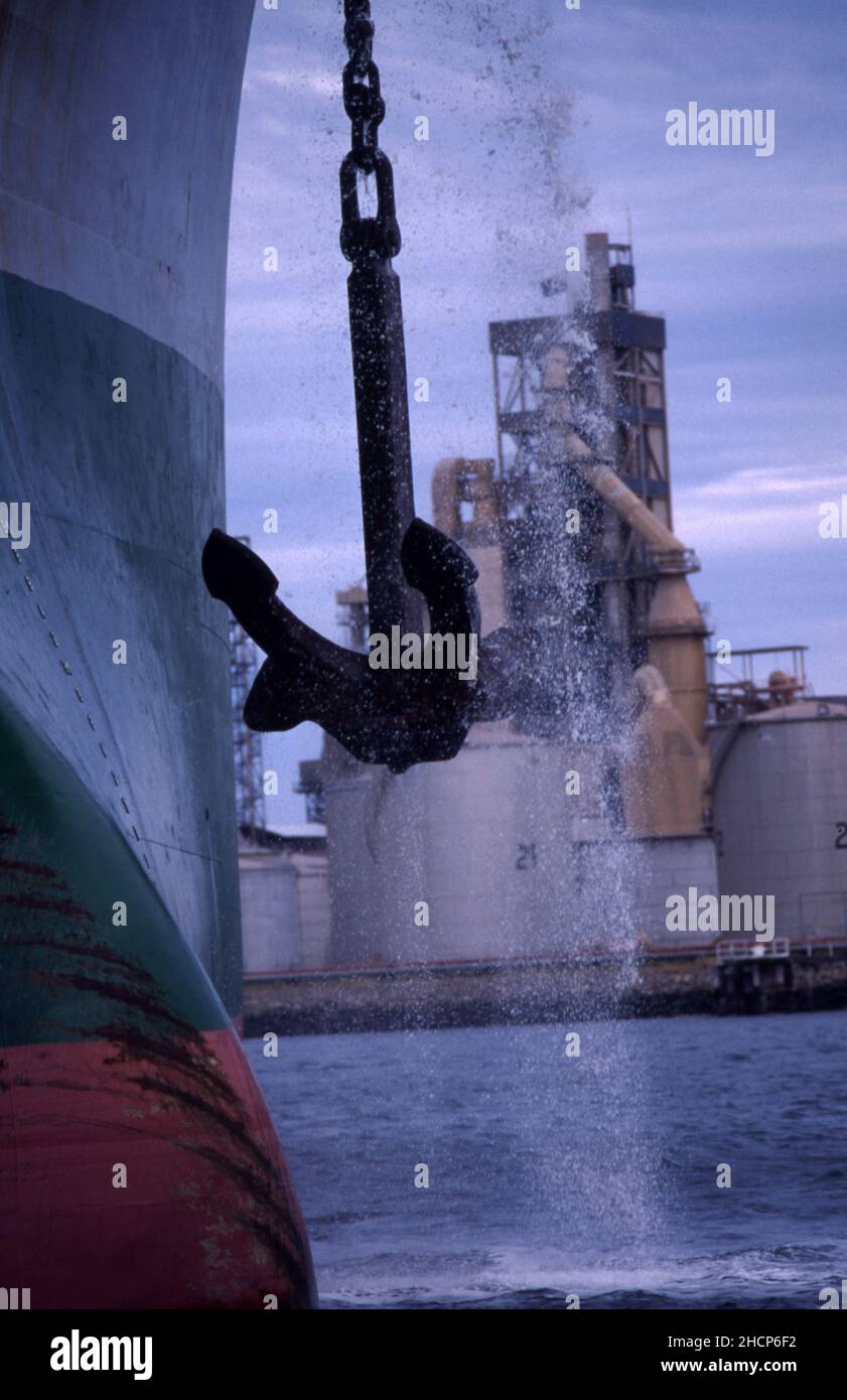 LARGE CONTAINER SHIP LIFTING ANCHOR, PORT ADELAIDE, SOUTH AUSTRALIA. Stock Photo