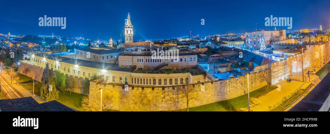 Panoramic view of the new gate in the old city walls, with Christmas tree and Christmas lights. Jerusalem, Israel Stock Photo