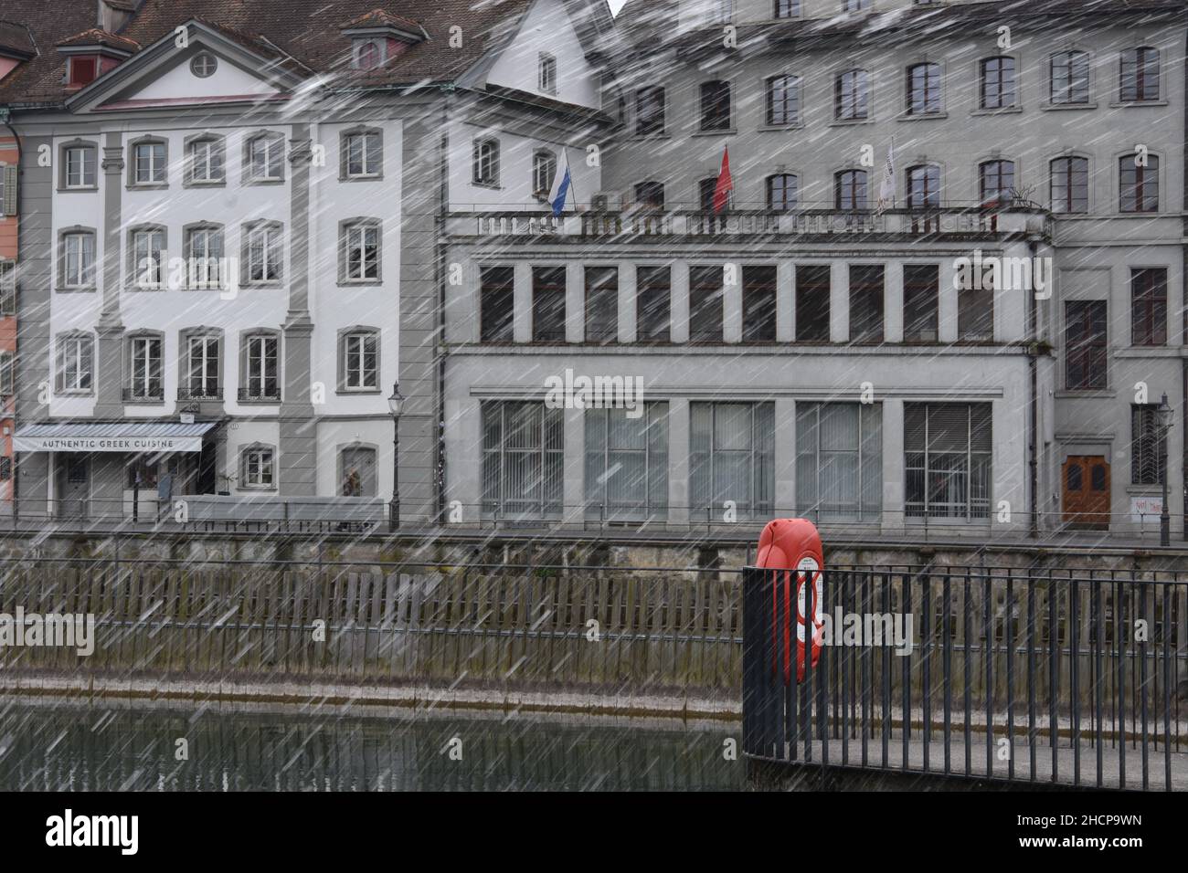 Heavy rain falling down in the city center of Lucerne. Stock Photo