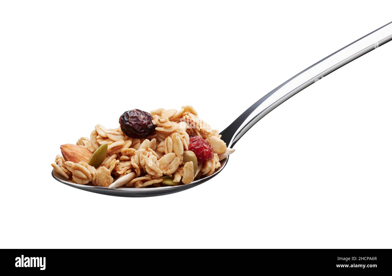 spoonful of granola isolated on white background Stock Photo