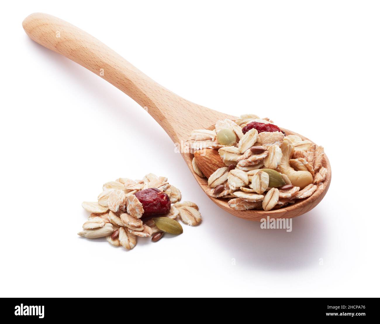 heap of muesli with wooden spoon Stock Photo