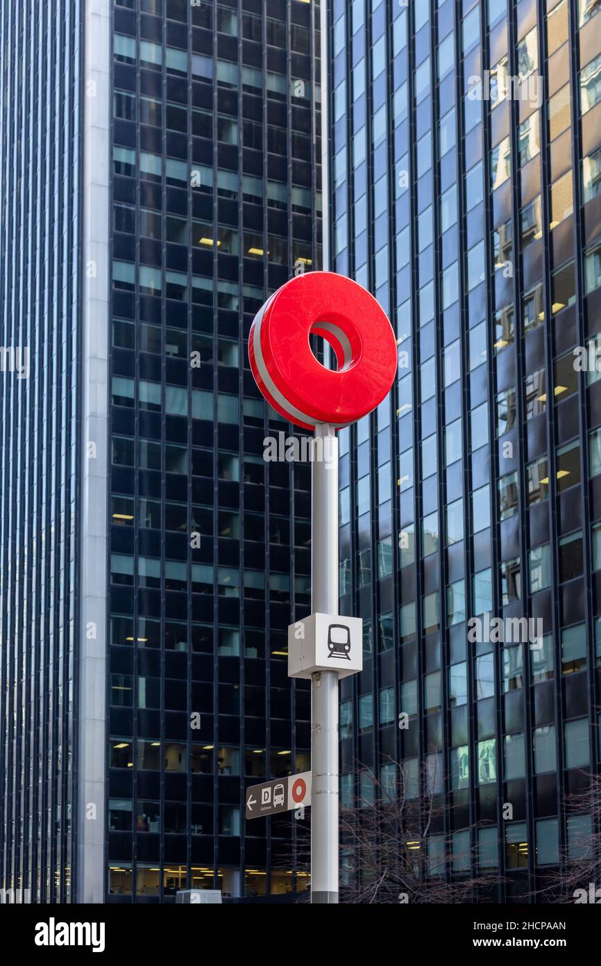 Ottawa, Canada December 16, 2021 Ottawa red O Train, OC Transpo transfer station sign against