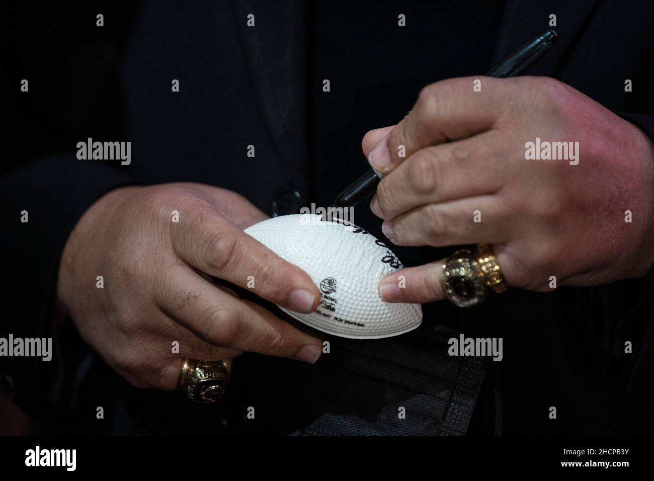 Anthony Davis (USC) signs a commemorative football during the Rose Bowl Hall of Fame Induction Ceremony, Thursday, Dec. 30, 2021, in Pasadena. (Jon En Stock Photo