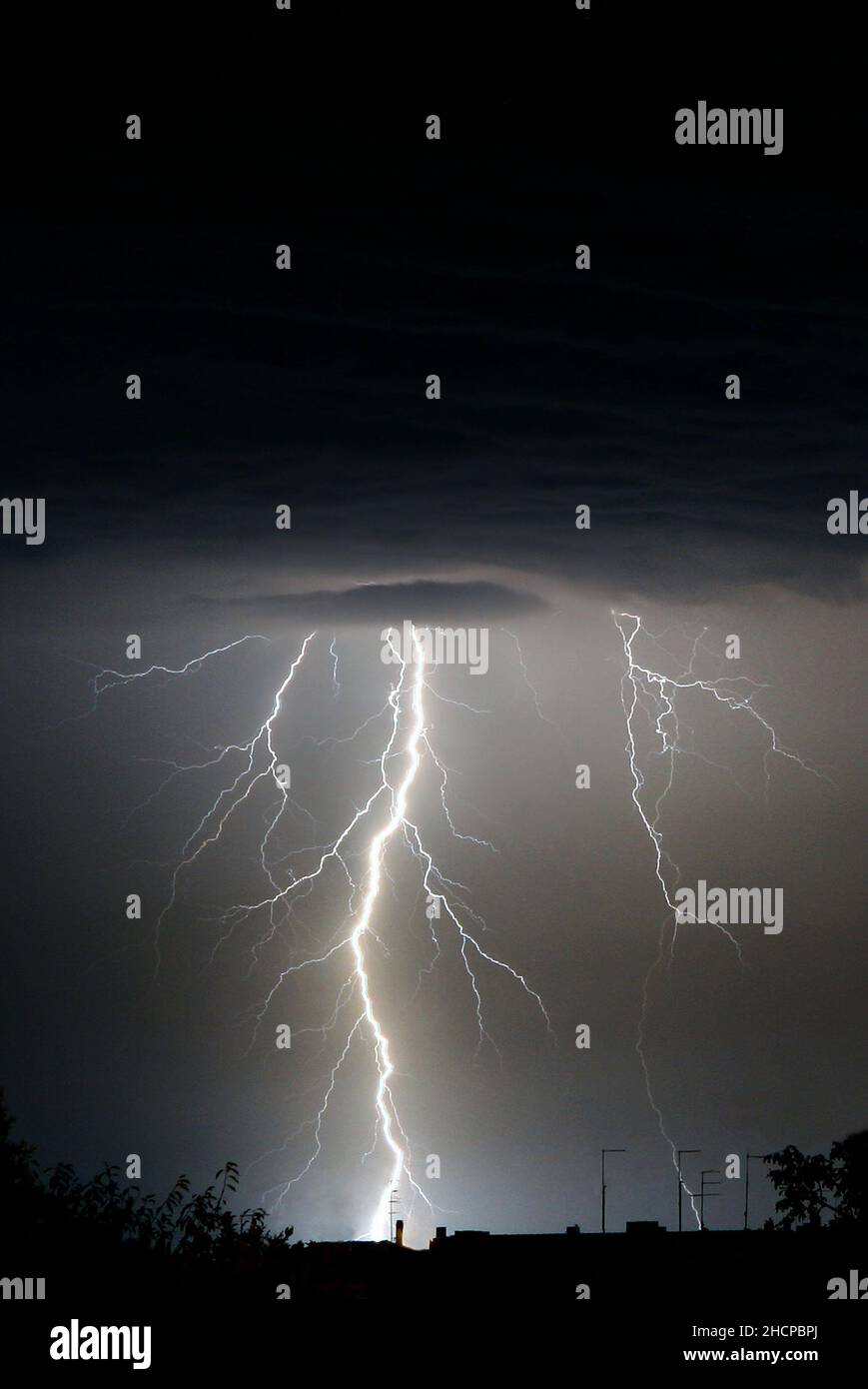 Lightning strikes during a thunderstorm Stock Photo - Alamy