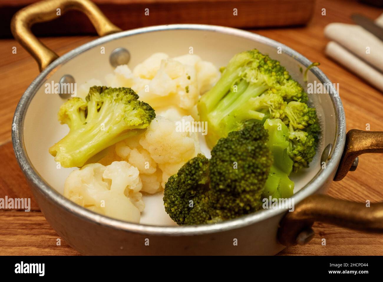 Broccoli and cauliflower steamed on a platter in a restaurant Stock