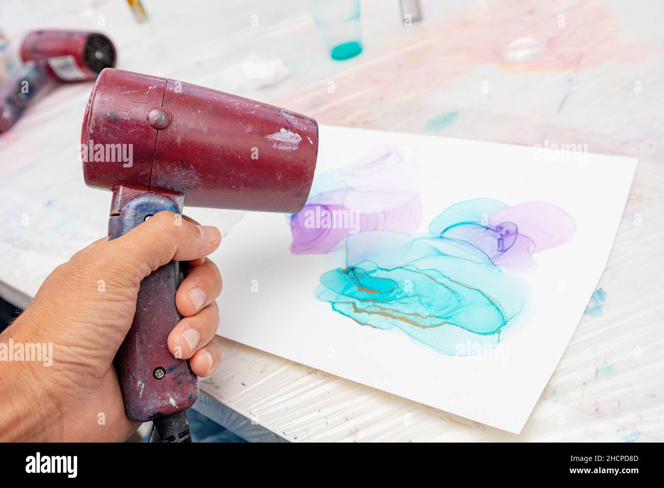 Trending technique of drawing with alcoholic ink, when a hot stream of