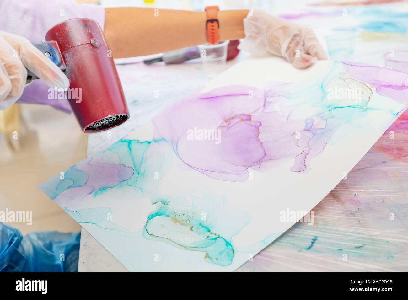 Trending technique of drawing with alcoholic ink, when a hot stream of