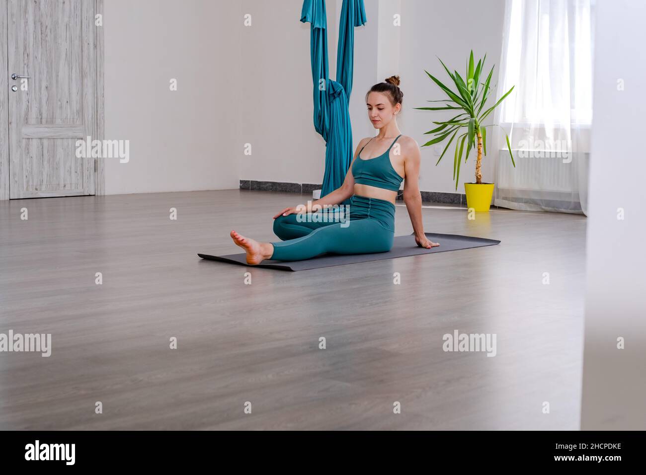 Portret of Young sporty attractive woman practicing yoga, working out Stock Photo