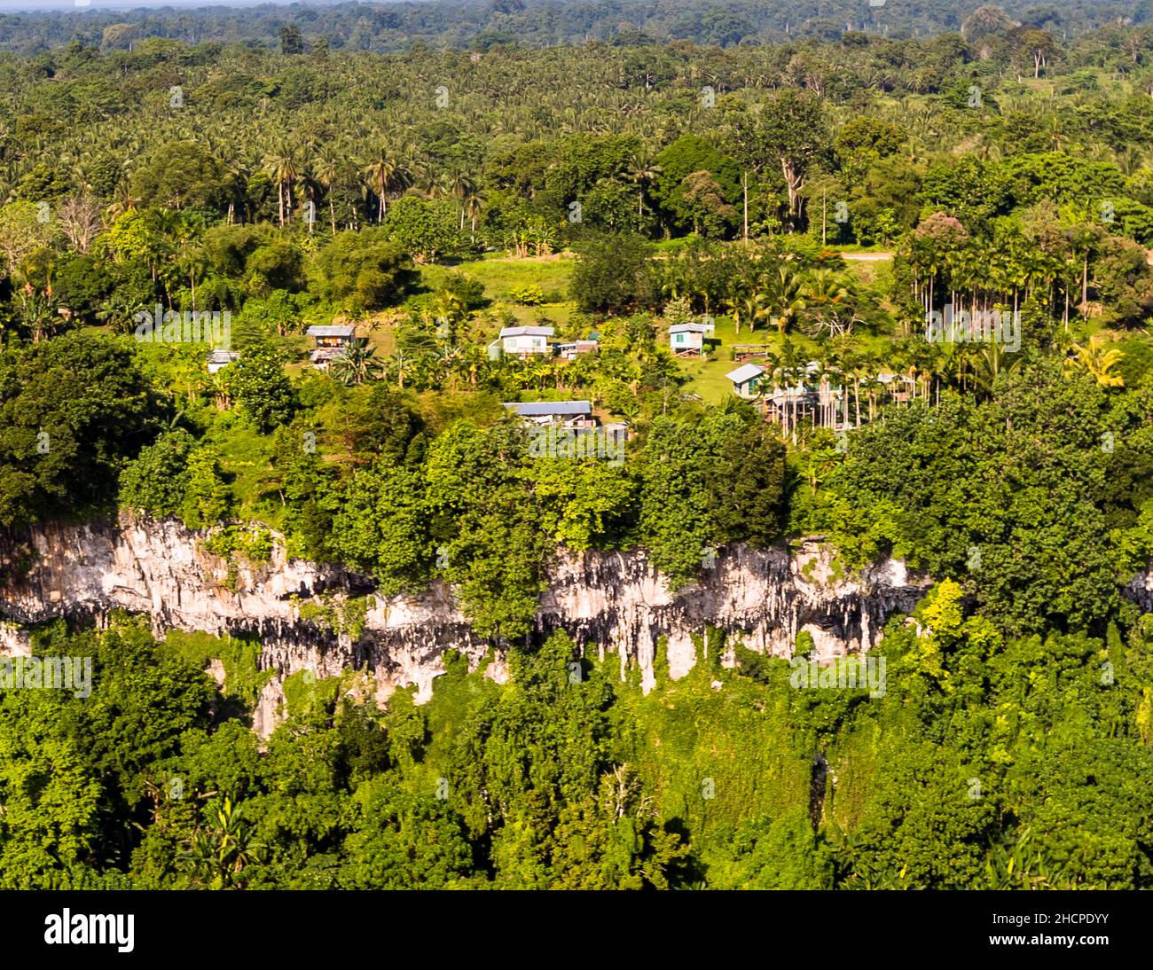Settlement above the cliffs of Bougainville, Papua New Guinea Stock Photo