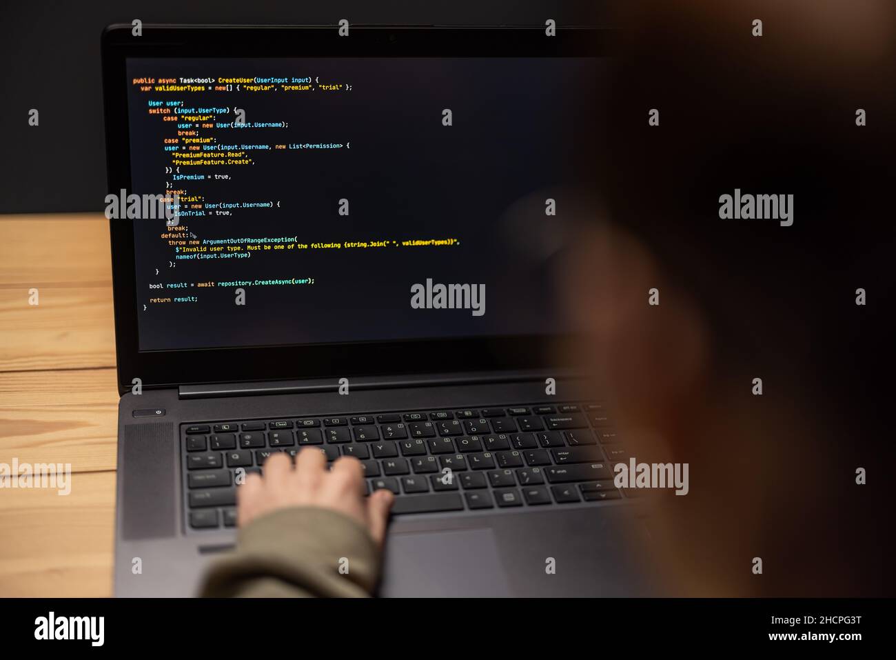 Woman using laptop for data code Stock Photo