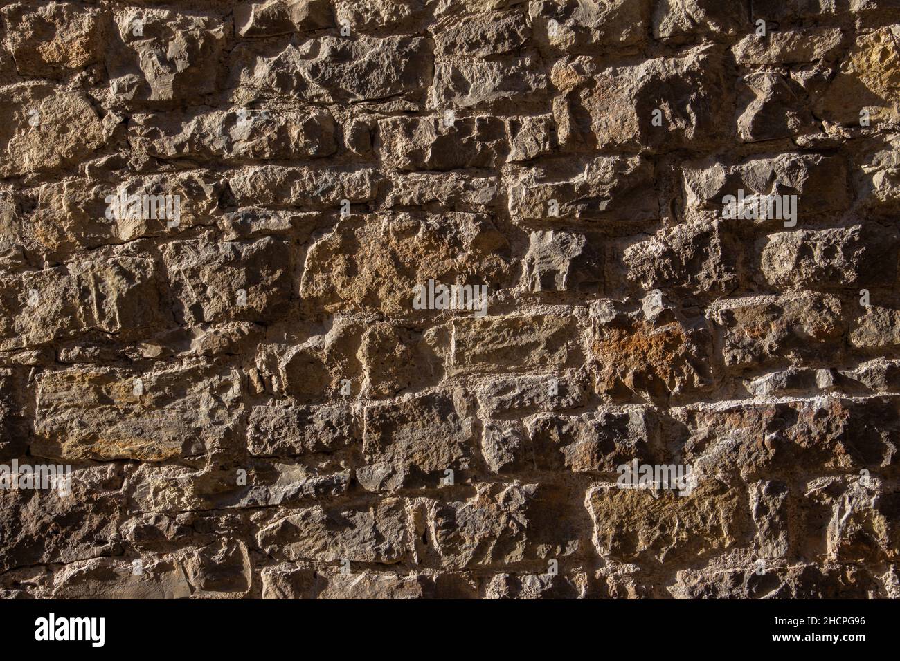Old natural stone wall for background Stock Photo