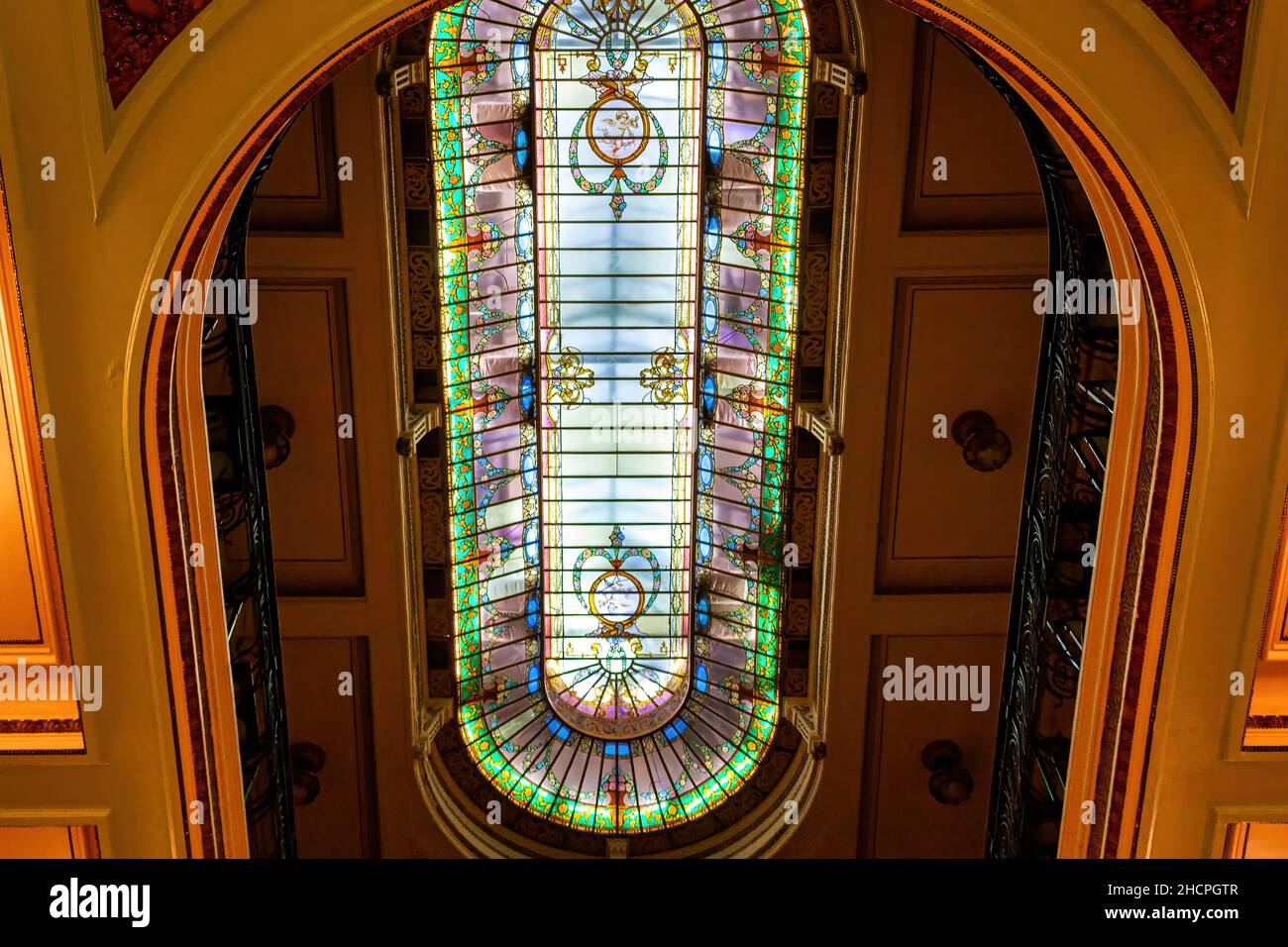 Low angle view of the stained glass skylight in the Confeitaria Colombo (Colombo Confectionary). The business is famous place and tourist attraction i Stock Photo