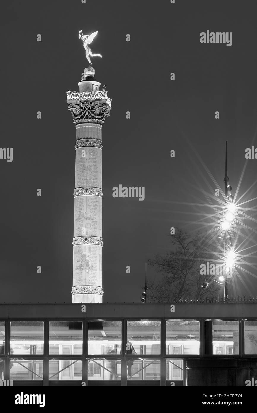 View of the illuminated  July column in Bastille Paris at night time in black and white Stock Photo