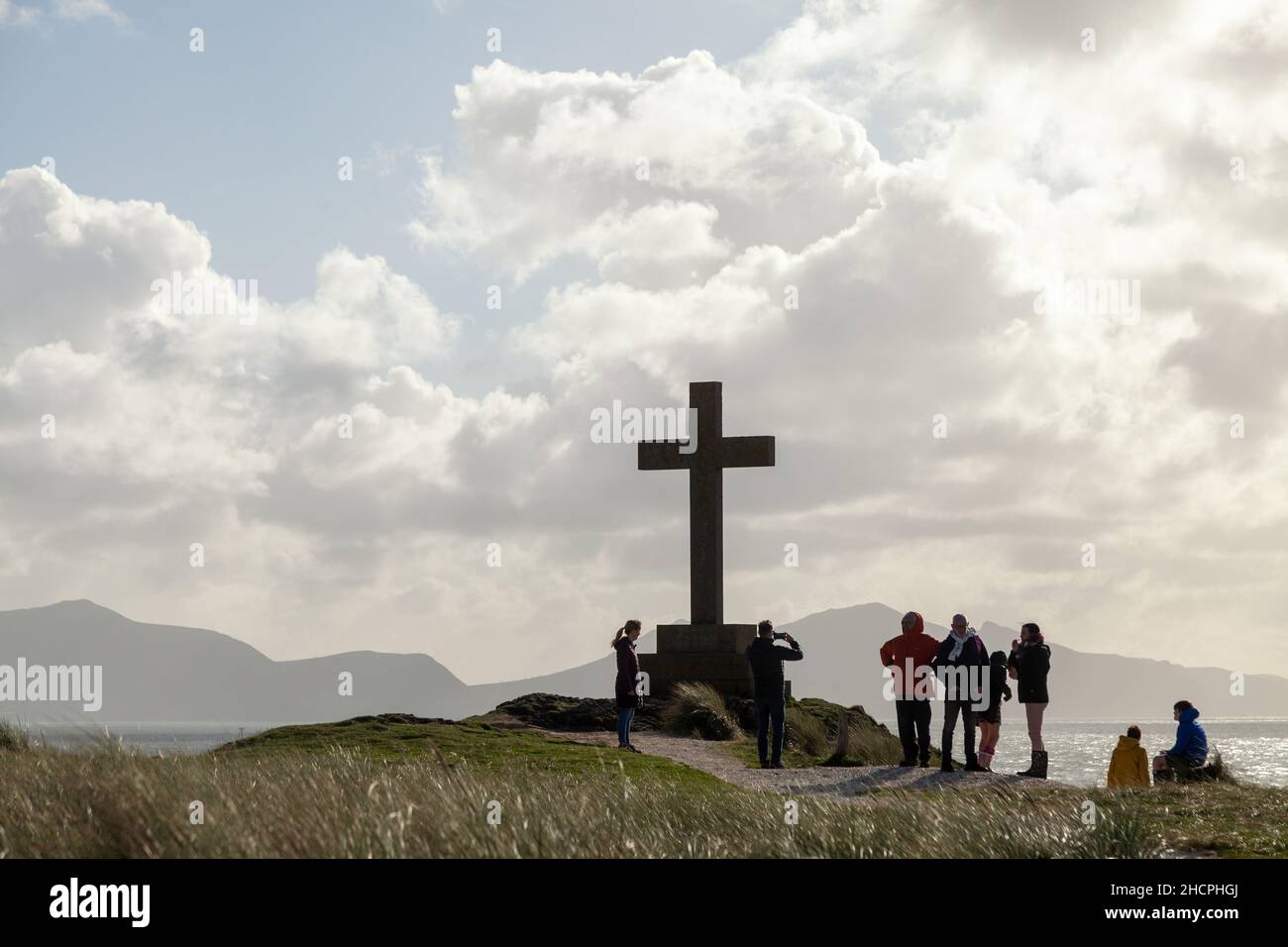 Stone cross of St Dwynwen Welsh patron saint of lovers. Llanddwyn Island Stock Photo
