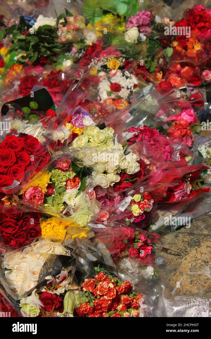 Many beautiful bouquets of cheerful roses and flowers as a celebration ...