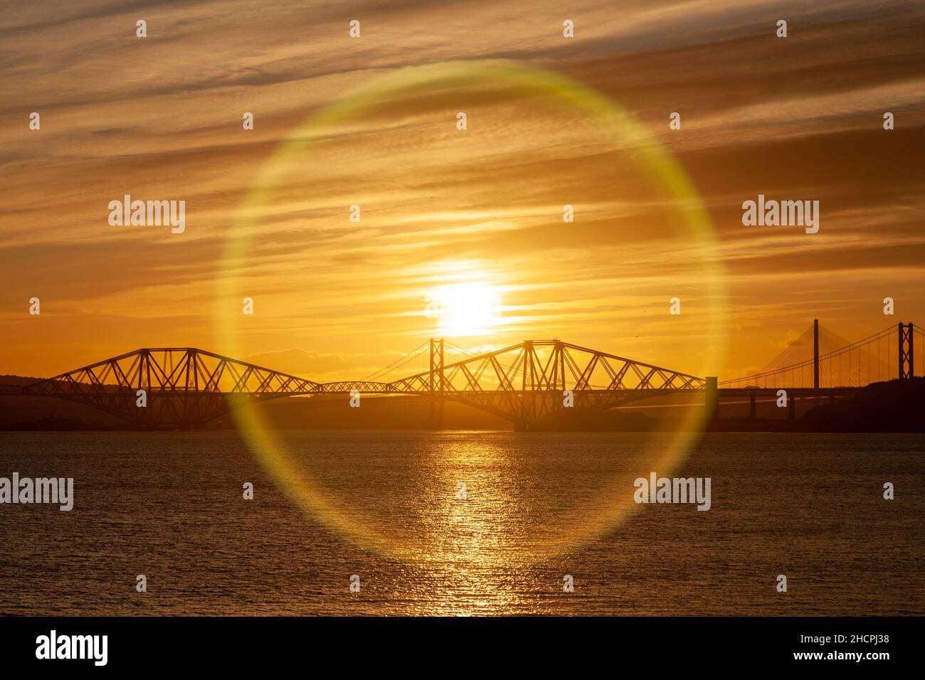 Sunset over the Forth Bridge seen from Dalgety Bay Stock Photo