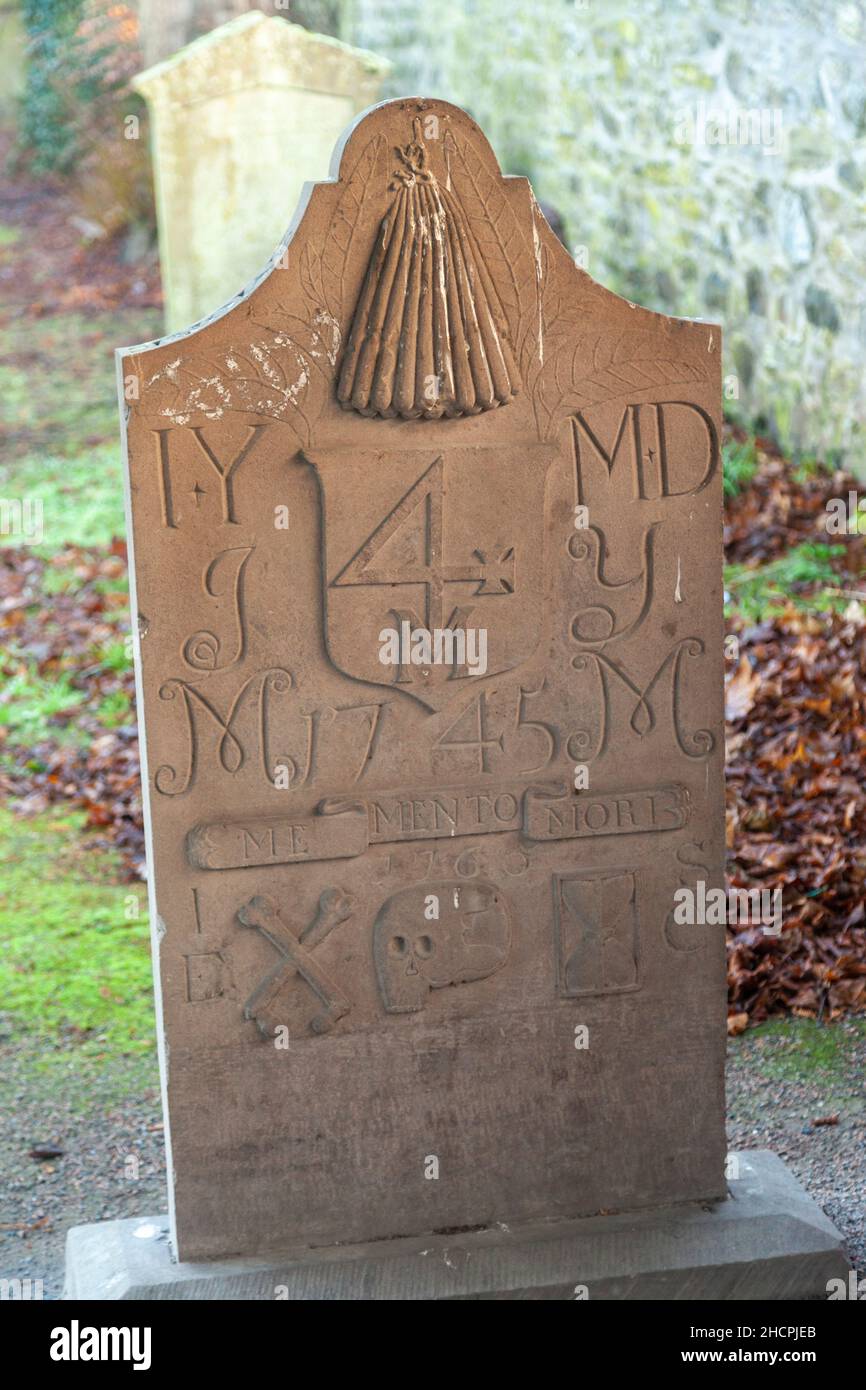 A very old headstone with lots of carvings Stock Photo - Alamy