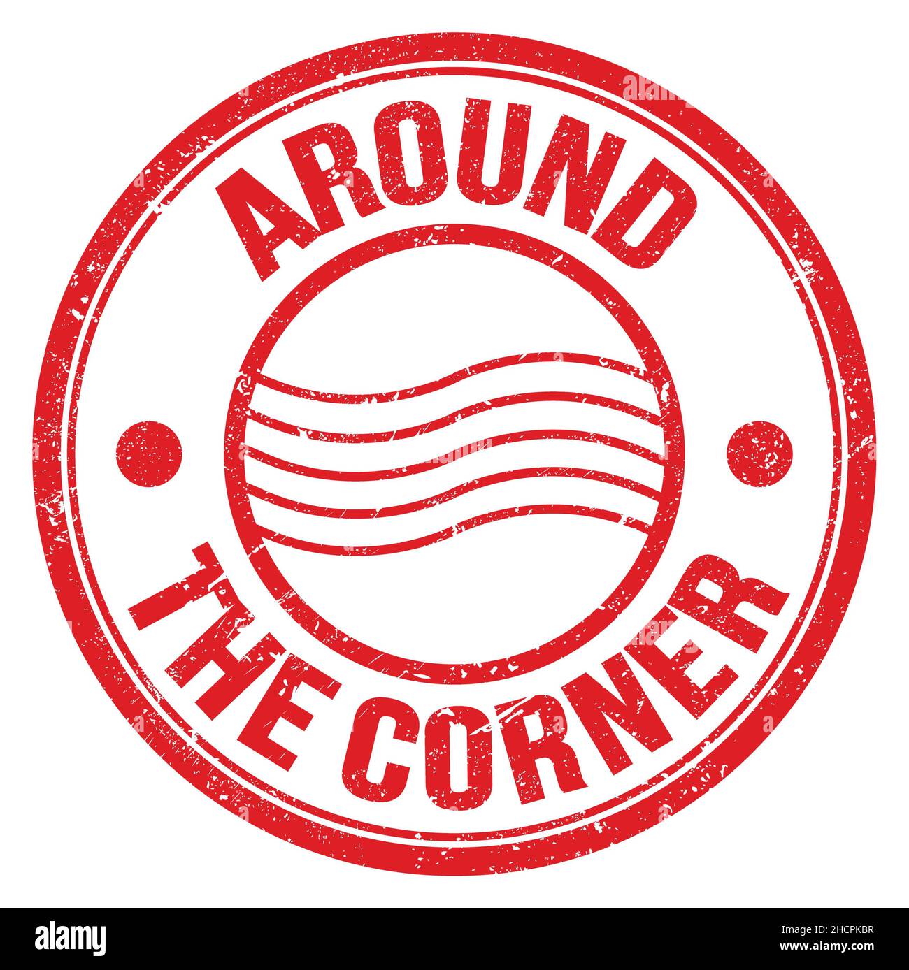 AROUND THE CORNER text written on red round postal stamp sign Stock ...