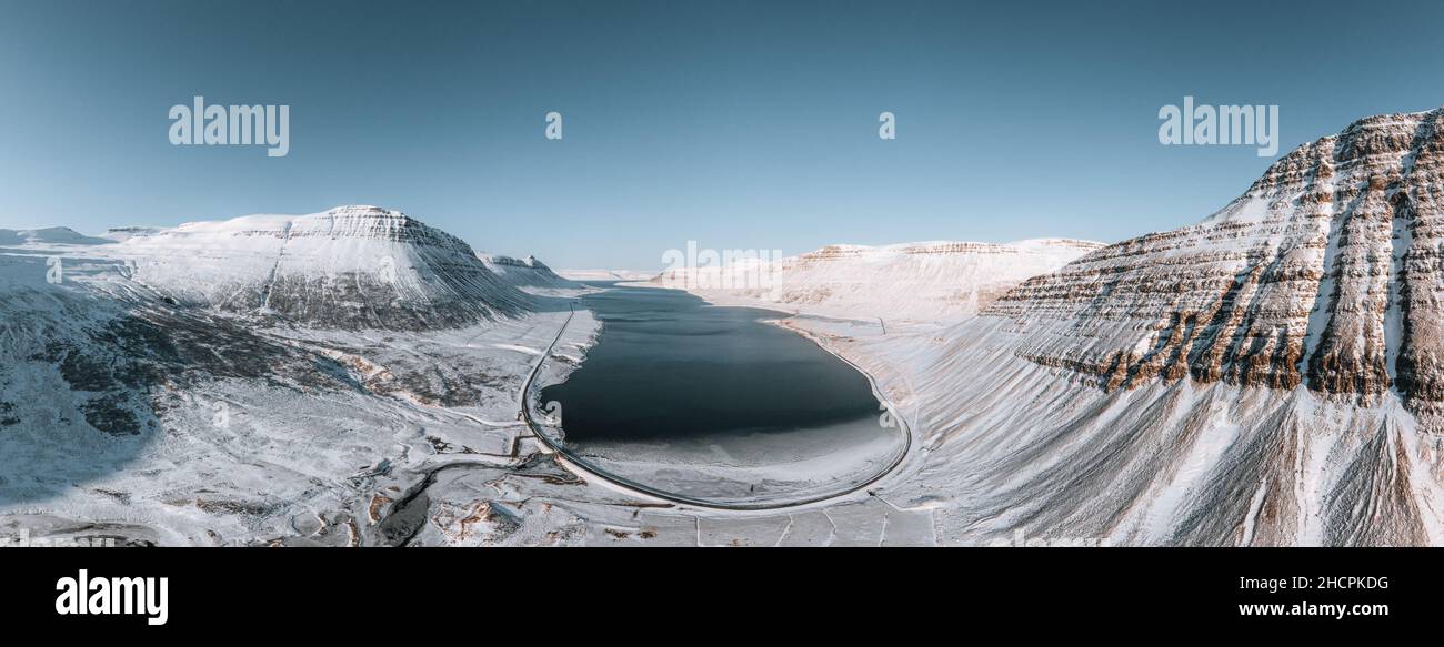 Aerial Drone Panorama view of Westfjords mountains in Icealand. Blue sky in the Westfjords region in Iceland. Nature landscape from above. Stock Photo