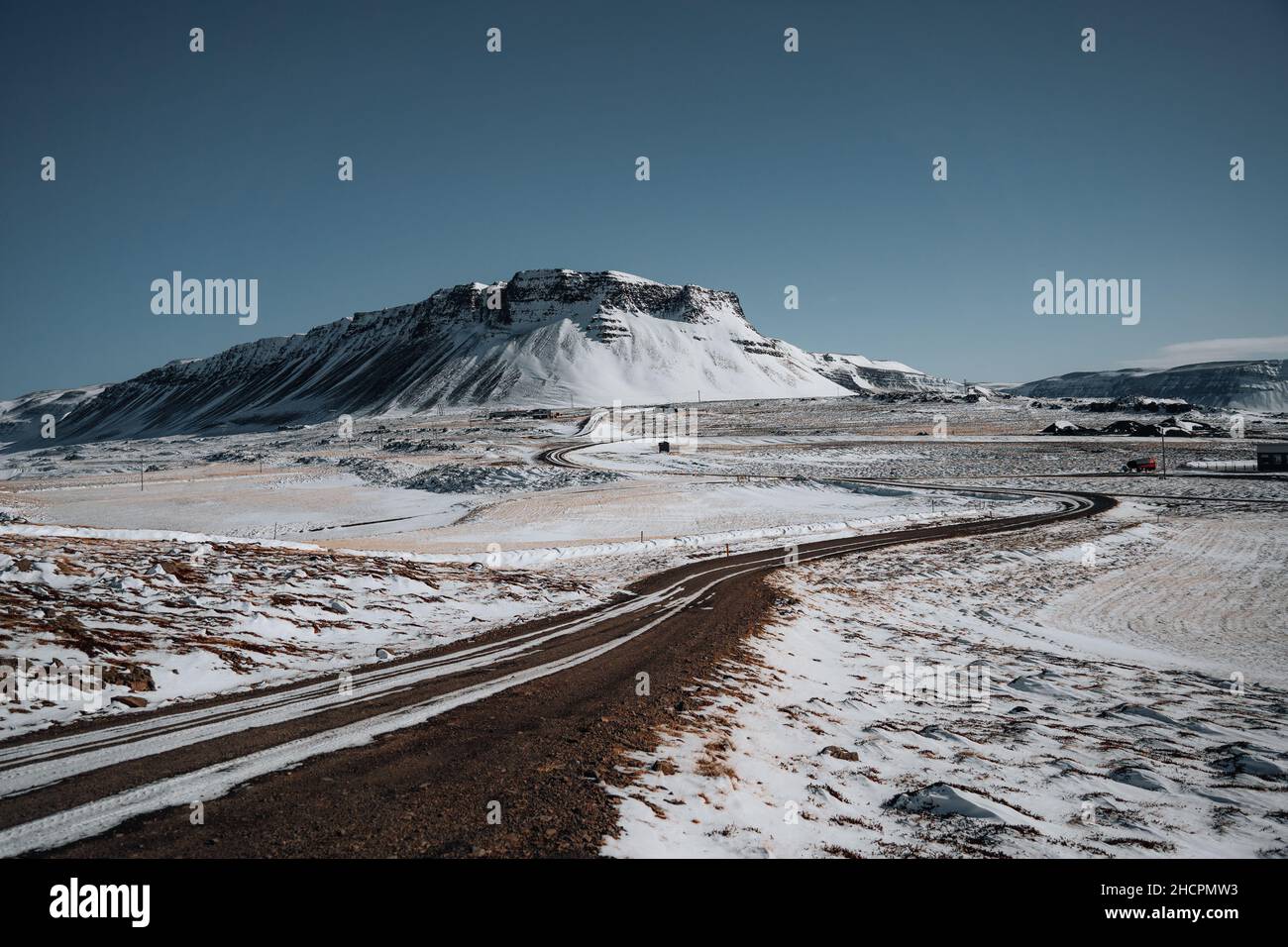Winter roadtrup Iceland. Street Highway Ring road No.1 in Iceland, with view towards mountain. Southern side if the country. Road trip travel concept. Stock Photo