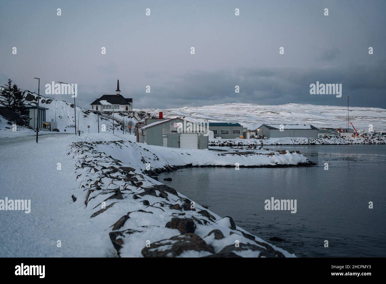 Town of Holmavik in Steingrimsfjordur fjord in Strandir in North Iceland during winter with snow. Stock Photo