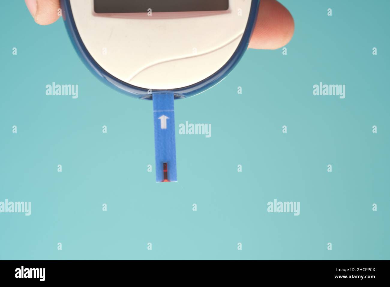 holding measuring blood sugar level top view Stock Photo