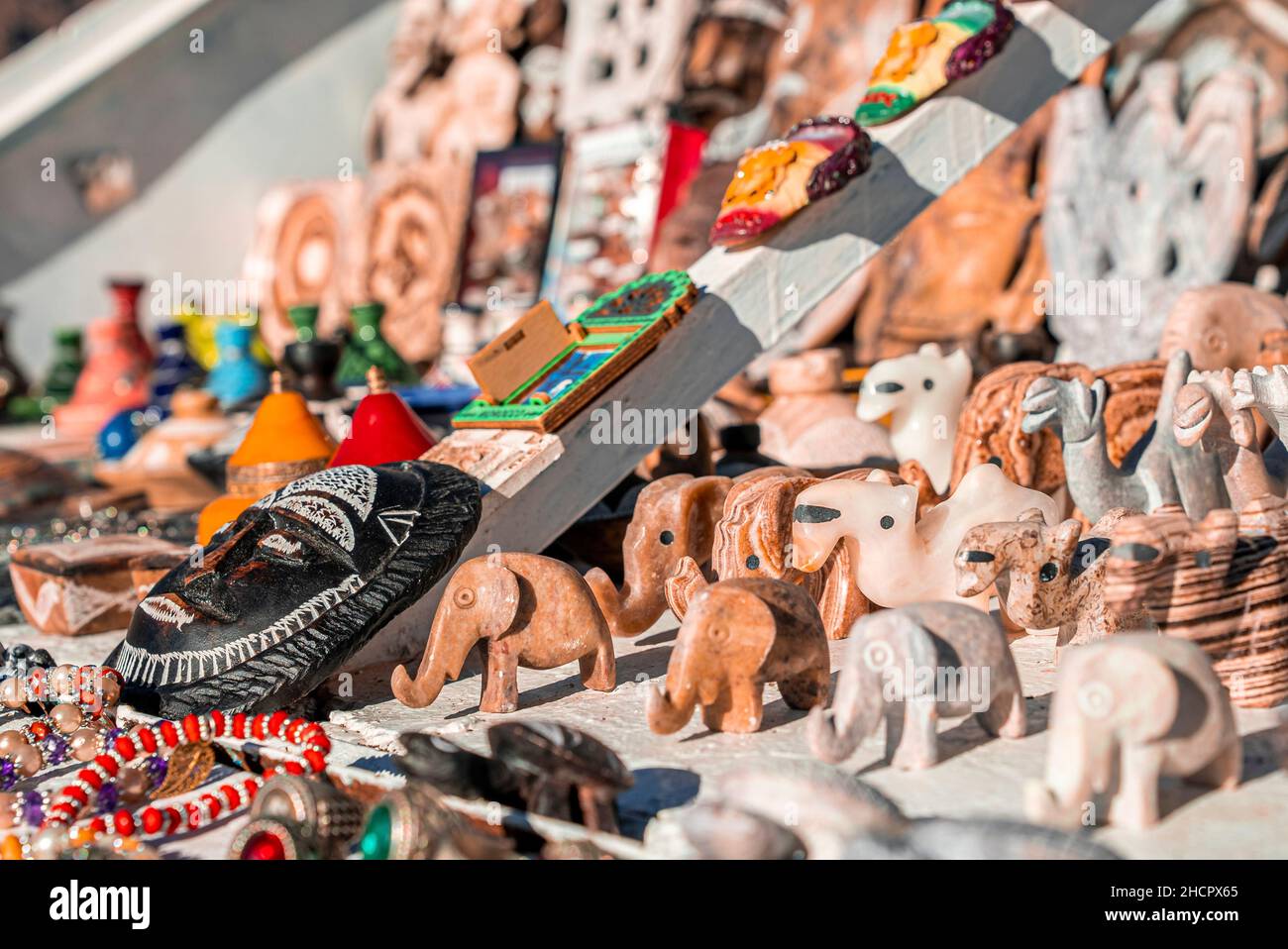 Small figurines of animals carved from stone or marble for sale at