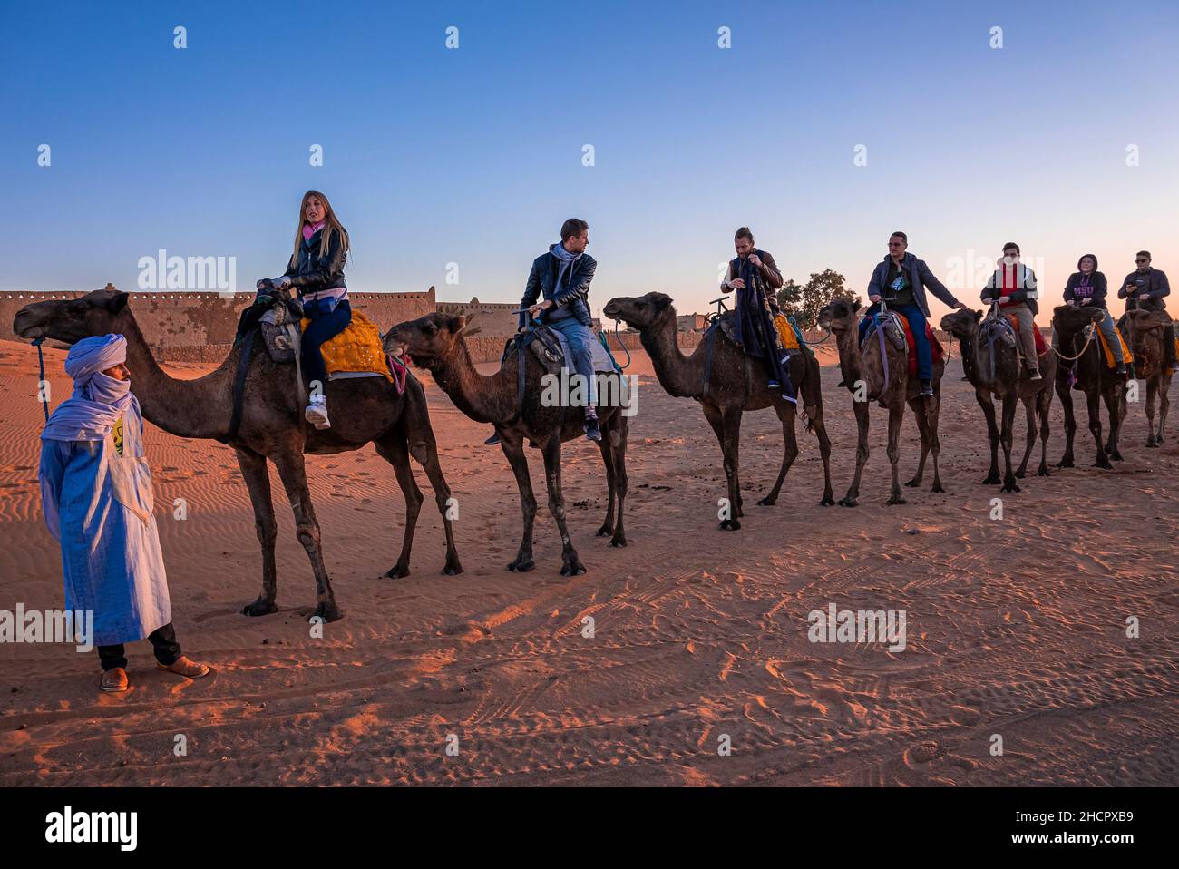 Tourists in desert clothing ride hi-res stock photography and images - Alamy
